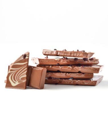 Vertical stack of Gourmet Triple Chocolate Bar with two pieces facing the front
