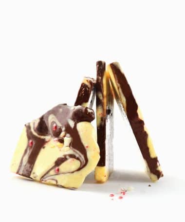 4 pieces of gourmet Peanut Butter Bark standing on their ends to form a pyramid shape