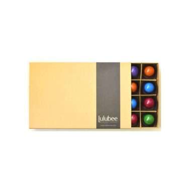 A kraft-colored box with a cigar band containing the Lulubee brand; box is open to reveal some bonbons