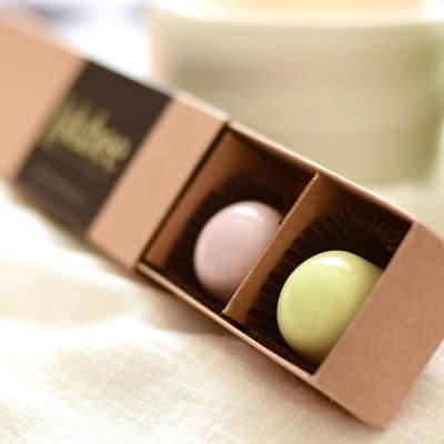6-piece box of pastel-colored gourmet chocolate truffles in a kraft box with a label that reads Lulubee Artisanal Chocolates