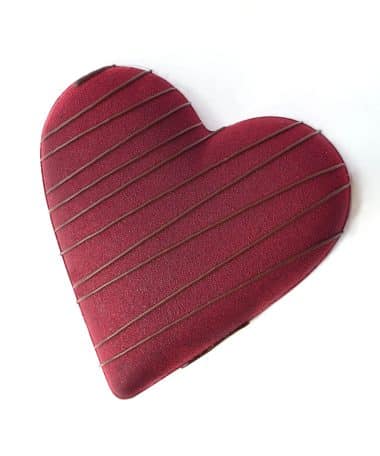 Large gourmet dark chocolate Valentine Heart filled with smooth mint and crunchy cookies. Heart is chocolate with dark chocolate stripes. Gluten- and dairy-free