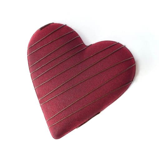 Large gourmet dark chocolate Valentine Heart filled with smooth mint and crunchy cookies. Heart is chocolate with dark chocolate stripes. Gluten- and dairy-free