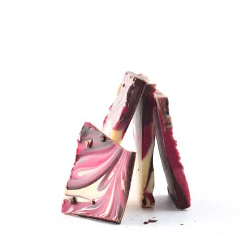 4 pieces of gourmet Raspberry Bark standing on their ends to form a pyramid shape