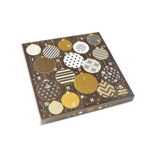Black and gold ornaments adorn an advent calendar filled with gourmet chocolates