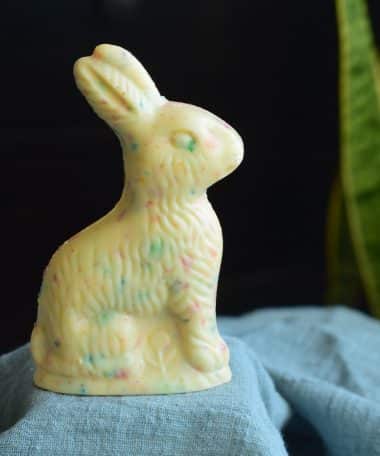Solid white chocolate Easter bunny with colorful specks of Fruity Pebbles cereal