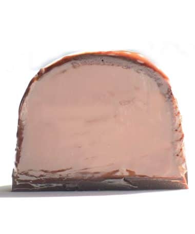 Inside view of a gourmet truffle that contains a ganache made from lavender-infused cream and milk chocolate