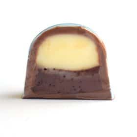 Inside view of a gourmet truffle that contains a layer of mascarpone ganache on top of a layer of coffee ganache