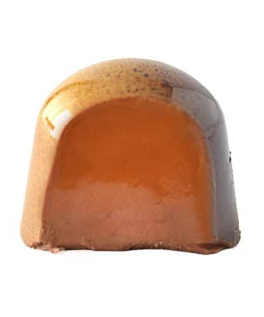 Inside view of a gourmet chocolate truffle that contains a brown butter caramel