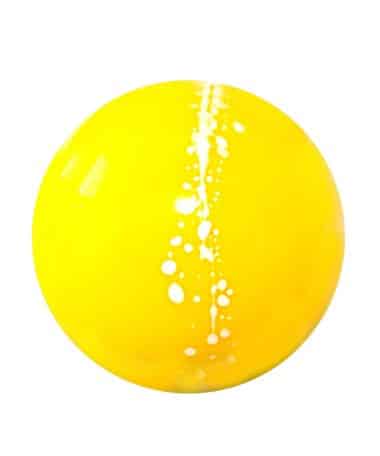 Overhead view of a yellow gourmet chocolate truffle with a white, dotted line that is off center; the truffle tastes like lemon