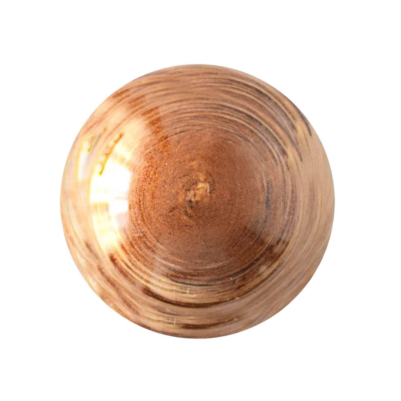 Overhead view of a light-brown gourmet chocolate truffle with concentric circles in a light tan; truffle tastes like mocha