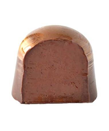Inside view of a gourmet chocolate truffle that contains a coffee-infused ganache