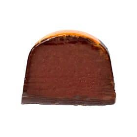 Inside view of a gourmet chocolate truffle that contains a dark chocolate and orange ganache