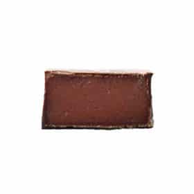 Inside view of a gourmet truffle that contains a contains raspberry caramel