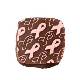 Overhead view of a square gourmet chocolate bonbon with Breast Cancer Awareness Pink Ribbons on top; contains raspberry caramel