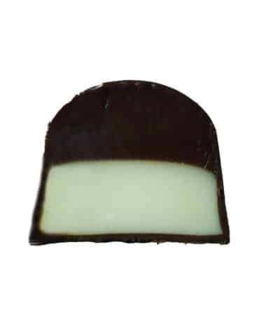 Inside view of a gourmet truffle that contains a layer of mascarpone ganache on top of a layer of coffee ganache