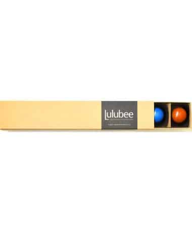 A kraft-colored box with a cigar band containing the Lulubee brand; box is open to reveal some bonbons