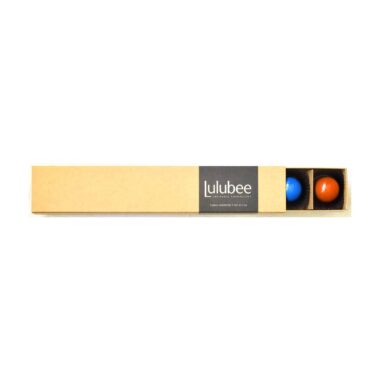 A kraft-colored box with a cigar band containing the Lulubee brand; box is open to reveal some bonbons
