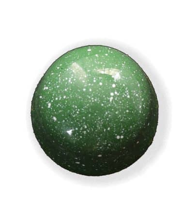 Overhead view of a green gourmet truffle with white speckles that contains a layer of handcrafted cherry jelly atop a house-ground pistachio ganache