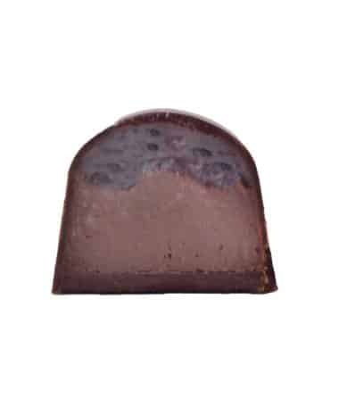Inside view of a Cherry Almond-flavored gourmet chocolate bonbon with two layers: cherry jelly and almond ganache