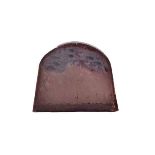 Inside view of a Cherry Almond-flavored gourmet chocolate bonbon with two layers: cherry jelly and almond ganache