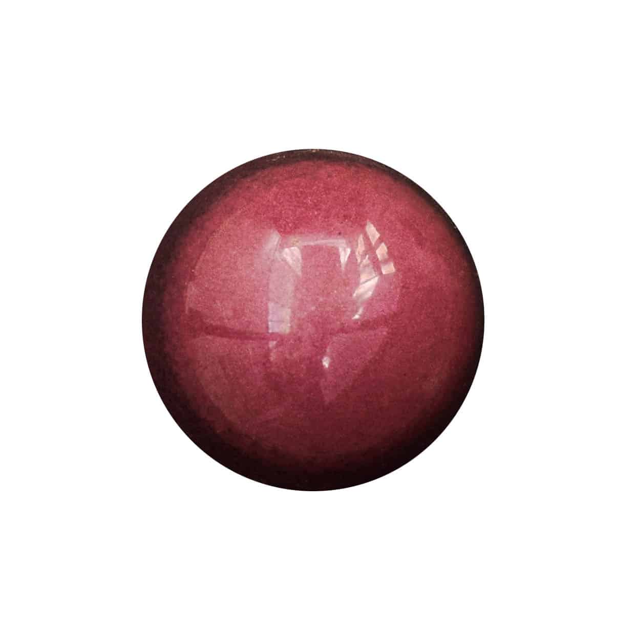 Overhead view of a deep pink gourmet chocolate bonbon that has a Cherry Almond filling