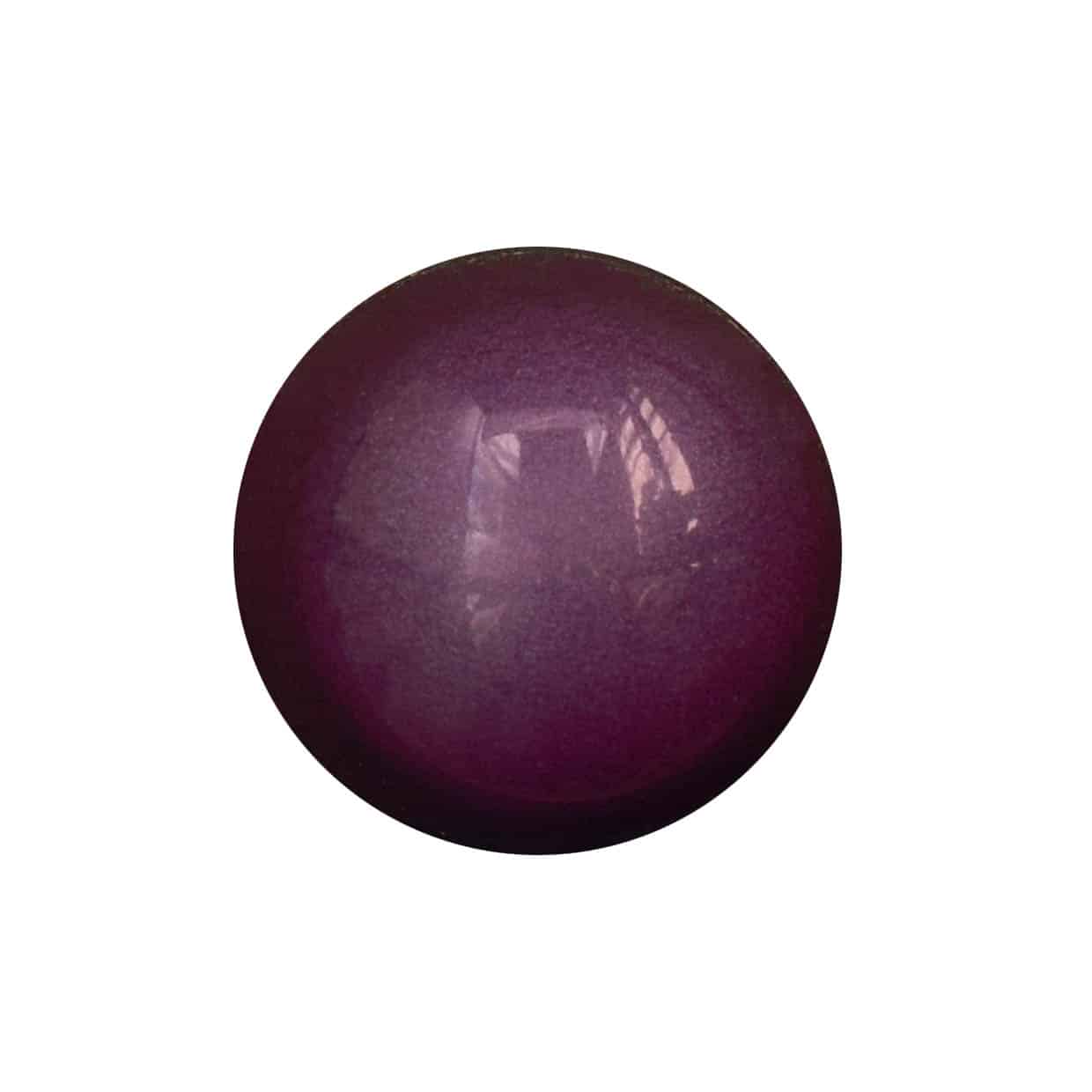 Overhead view of a purple-colored gourmet chocolate bonbon that is flavored with Cherry Cheesecake