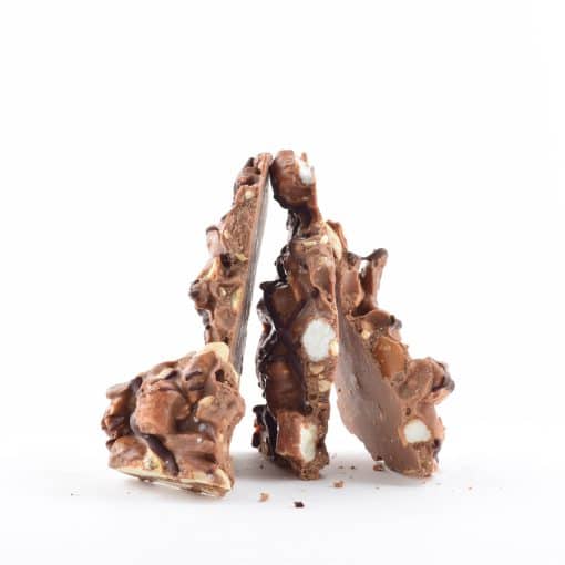 4 pieces of gourmet Peanut Rocky Road Bark standing on their ends to form a pyramid shape