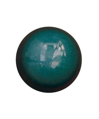 Overhead view of a deep teal-colored gourmet chocolate bonbon that tastes like Tiramisu