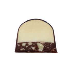 Inside view of a gourmet chocolate truffle with a thick layer of coconut ganache atop a thin layer of almond pieces