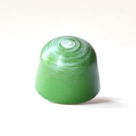 Leaf green gourmet bonbon with a white spiral on its top