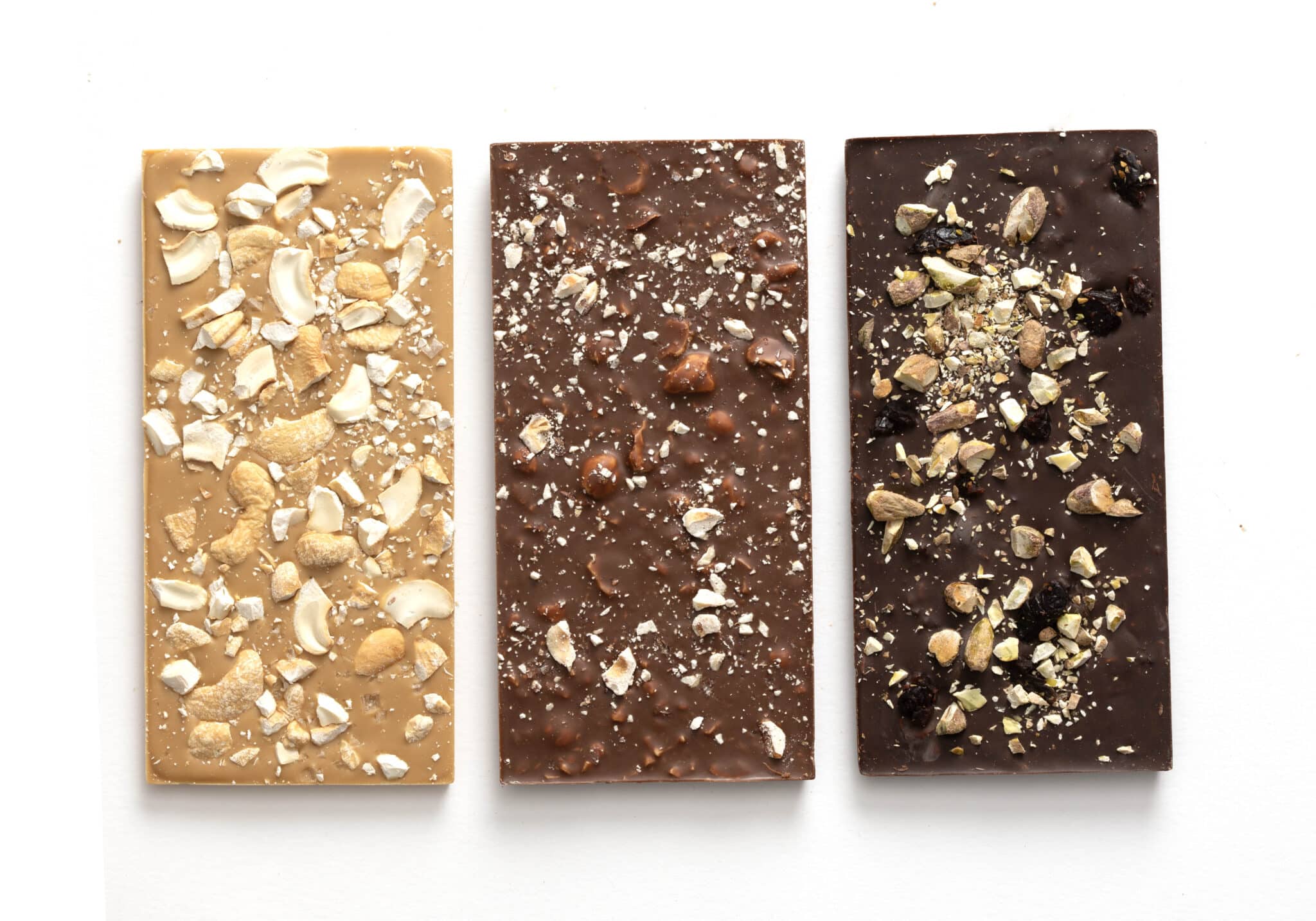 This Nut Lovers Chocolate Bar Sampler contains: Cashew and Caramelized White Chocolate Bar, Cherry and Pistachio Dark Chocolate Bar, Salted Hazelnut Milk Chocolate Bar